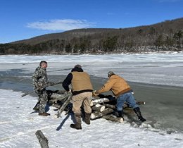 Three men on the creek