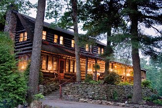 Exterior view of the lodge with night lighting