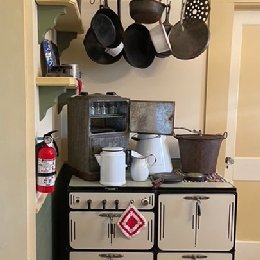 Historic kitchen showing stove and pots